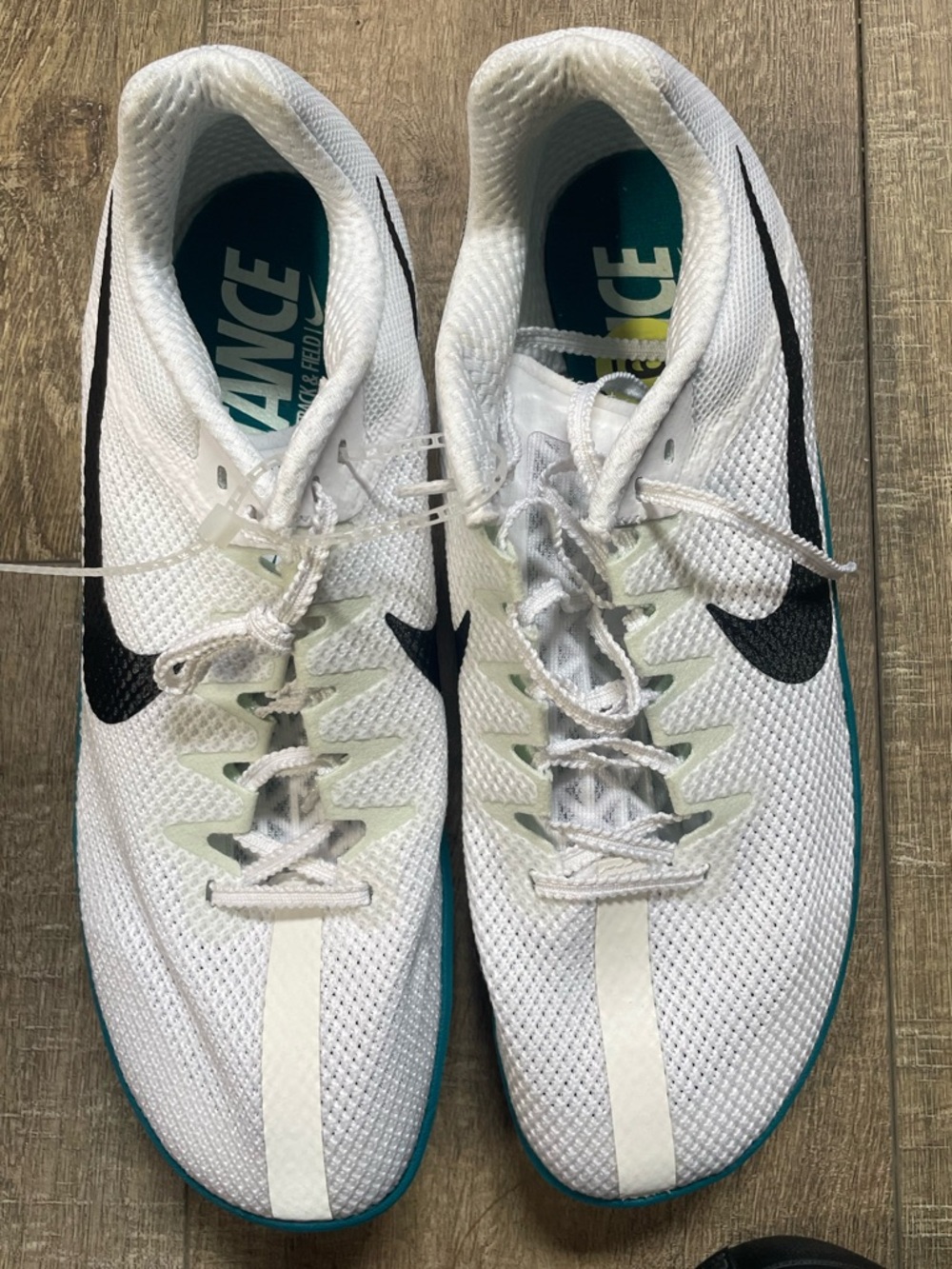 Nike White Distance Running Shoes with Black Swoosh and Teal Outsole